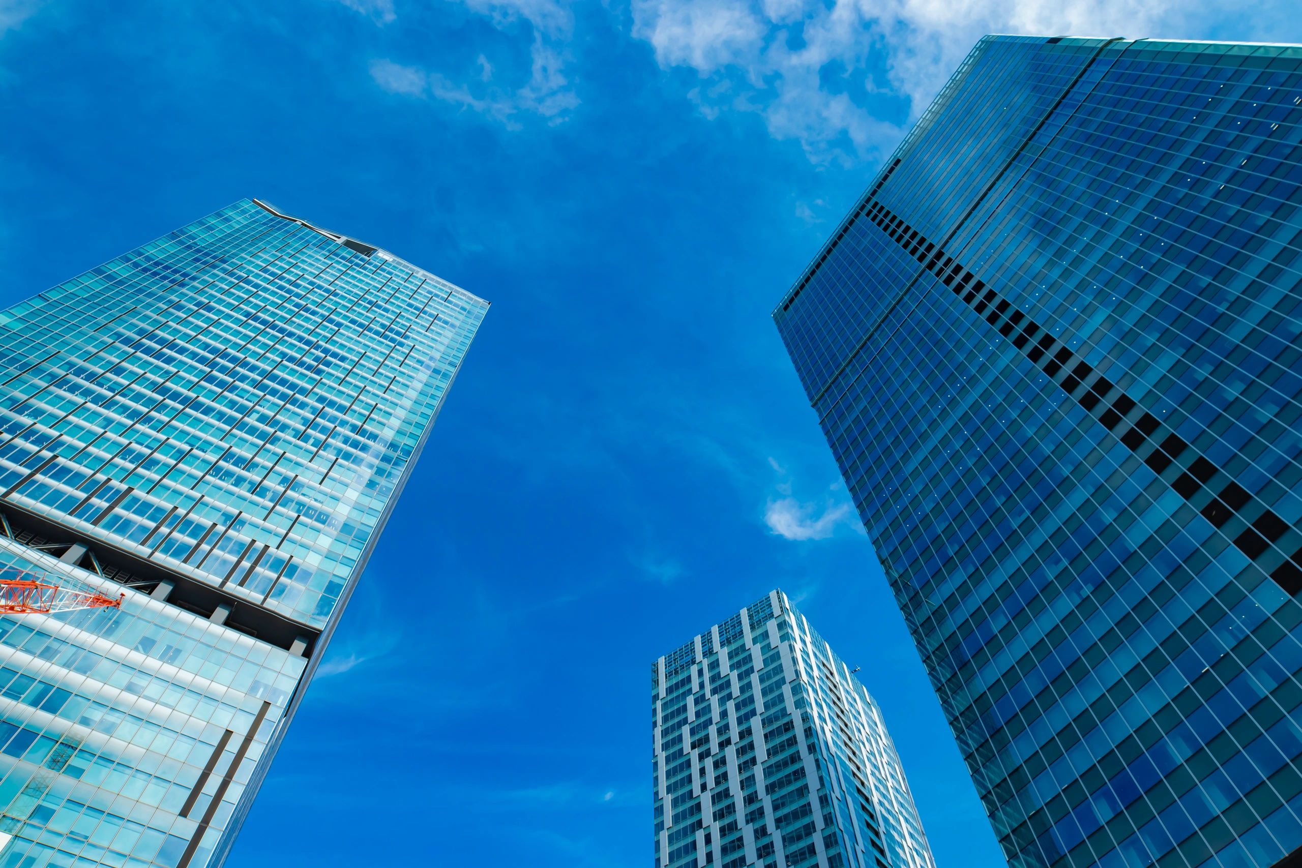 Clouds reflected on modern city buildings representing enterprise cloud transformation