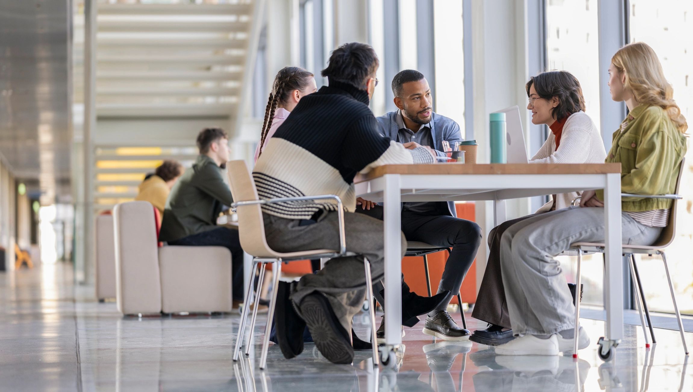 Consulting team collaborating in a modern office